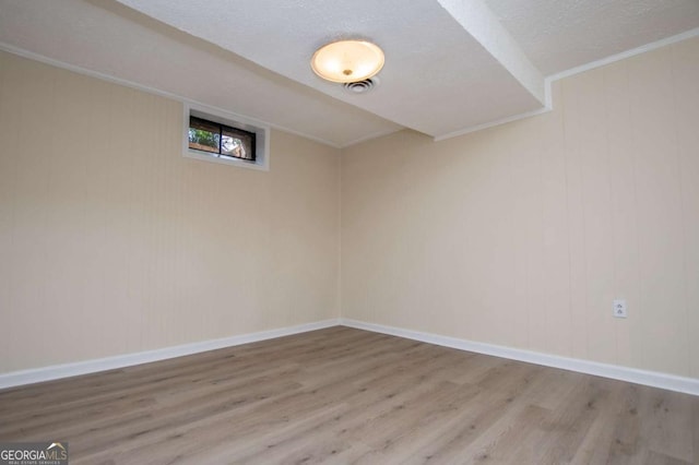 508 College St, Bowdon, GA 30108 - empty room with wood finished floors and a textured ceiling