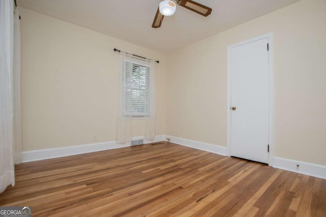 508 College St, Bowdon, GA 30108 - spare room featuring wood finished floors and a ceiling fan