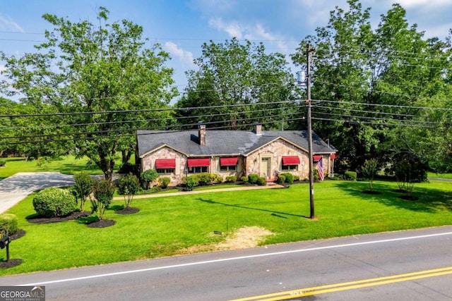 508 College St, Bowdon, GA 30108 - ranch-style home featuring stone siding, a chimney, and a front yard