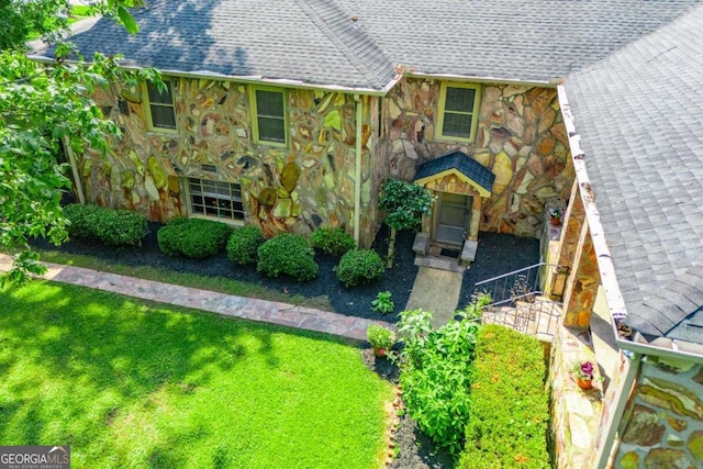 508 College St, Bowdon, GA 30108 - view of front of house with stone siding, a shingled roof, and a front yard