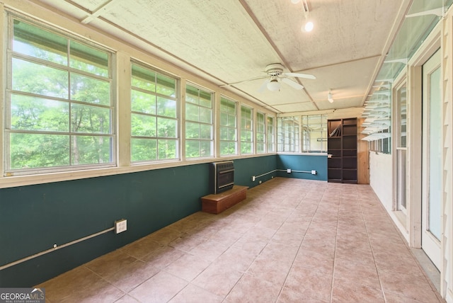 290 Bear Cave Trl, Lakemont, GA 30552 - unfurnished sunroom with tile patterned floors and heating unit
