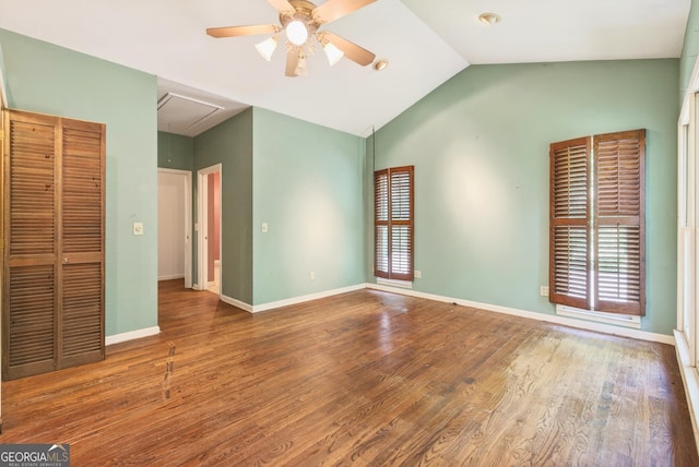 290 Bear Cave Trl, Lakemont, GA 30552 - unfurnished bedroom featuring attic access, lofted ceiling, wood finished floors, and ceiling fan
