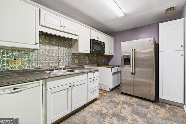 290 Bear Cave Trl, Lakemont, GA 30552 - kitchen featuring stainless steel fridge, white dishwasher, black microwave, backsplash, and white cabinets