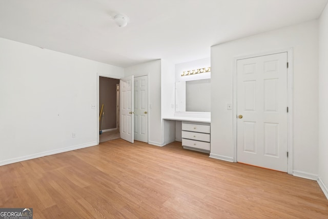 290 Bear Cave Trl, Lakemont, GA 30552 - unfurnished bedroom with light wood-style flooring and built in study area