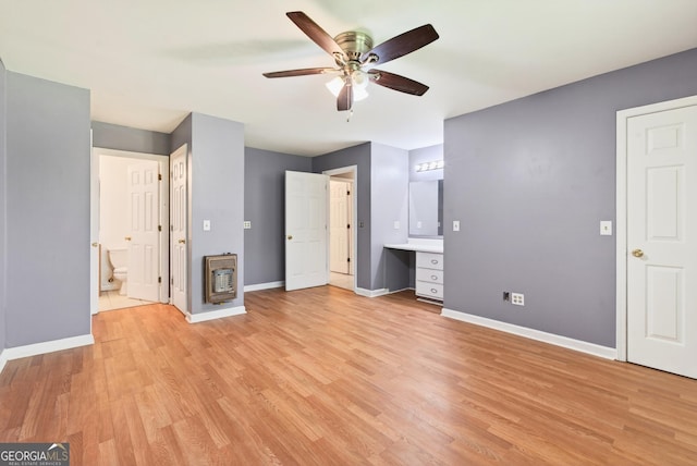 290 Bear Cave Trl, Lakemont, GA 30552 - unfurnished bedroom with light wood-style flooring, heating unit, connected bathroom, and built in study area