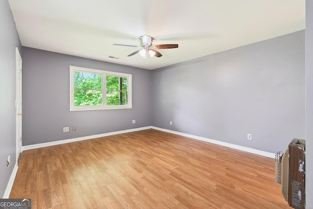 290 Bear Cave Trl, Lakemont, GA 30552 - spare room featuring a ceiling fan, light wood finished floors, and heating unit