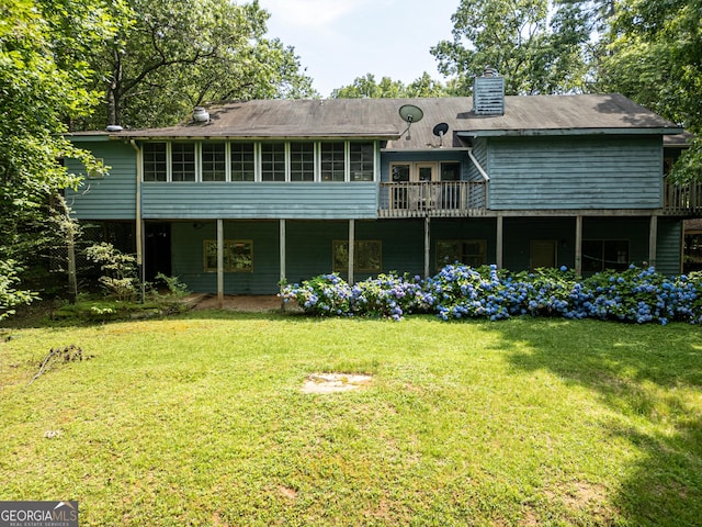 290 Bear Cave Trl, Lakemont, GA 30552 - rear view of house with a chimney, a yard, and a sunroom