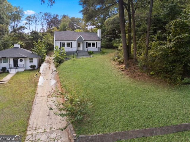 1630 Ezra Church Dr NW, Atlanta, GA 30314 - view of front of house featuring driveway, a chimney, and a front lawn