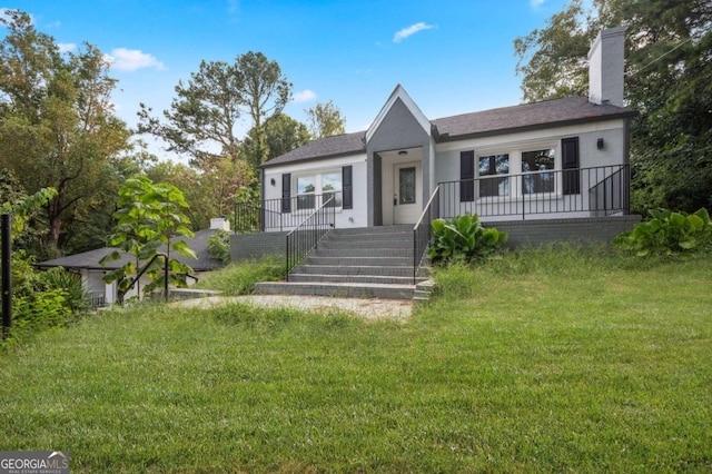 1630 Ezra Church Dr NW, Atlanta, GA 30314 - single story home featuring a front lawn and a chimney
