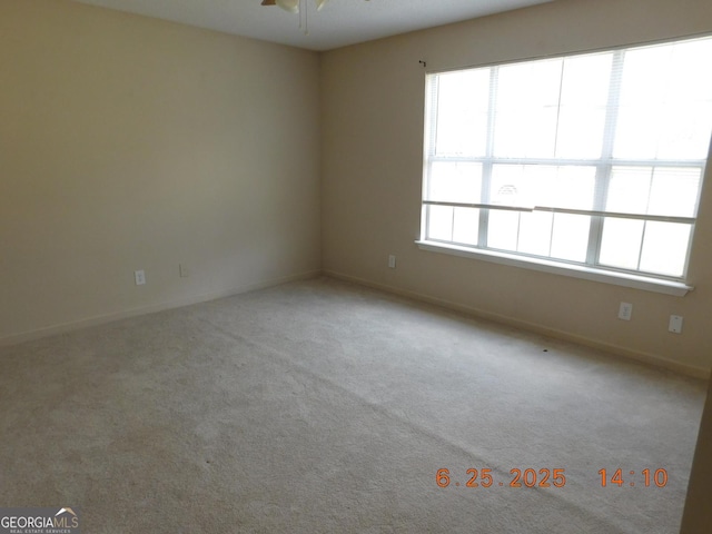132 Park Pl, Barnesville, GA 30204 - carpeted spare room featuring a ceiling fan and baseboards
