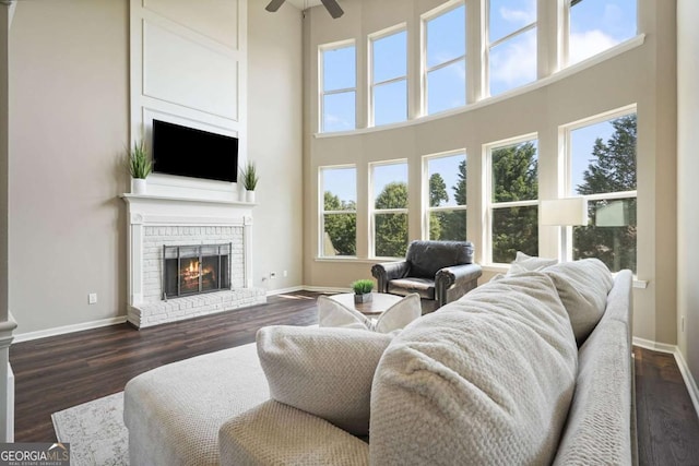 6665 Flagstone Ct, Cumming, GA 30028 - living room with plenty of natural light, a ceiling fan, dark wood finished floors, and a high ceiling