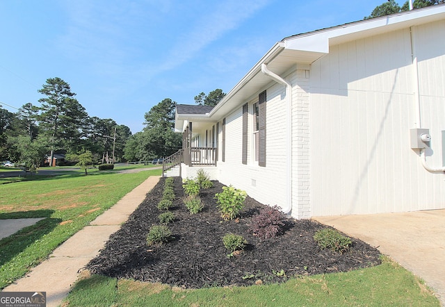 413 Spring Village Rd SE, Lindale, GA 30147 - view of property exterior with a lawn and brick siding