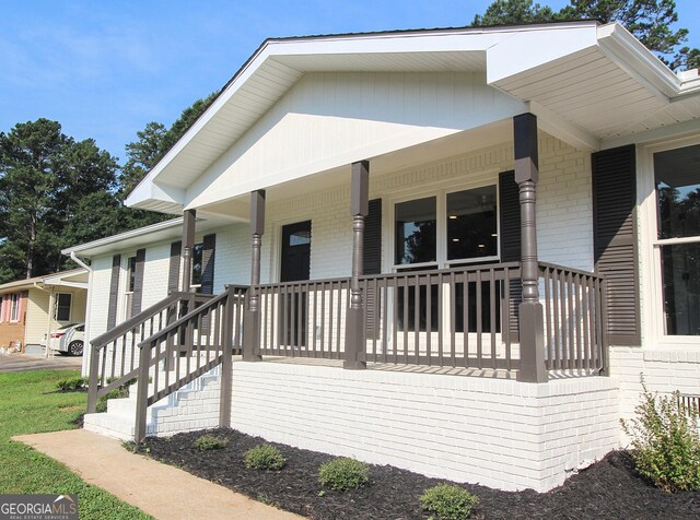 413 Spring Village Rd SE, Lindale, GA 30147 - view of front of house featuring brick siding and covered porch