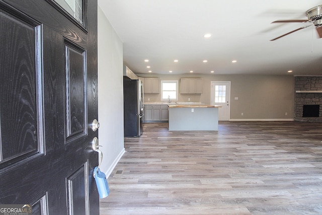 413 Spring Village Rd SE, Lindale, GA 30147 - kitchen with freestanding refrigerator, open floor plan, a ceiling fan, light wood-style floors, and recessed lighting