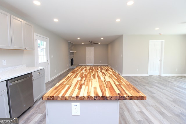 413 Spring Village Rd SE, Lindale, GA 30147 - kitchen featuring dishwasher, open floor plan, light wood-style floors, recessed lighting, and a stone fireplace