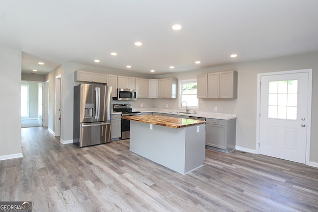 413 Spring Village Rd SE, Lindale, GA 30147 - kitchen with stainless steel appliances, butcher block counters, gray cabinets, recessed lighting, and light wood-style flooring