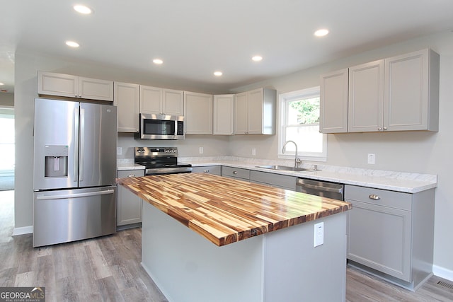 413 Spring Village Rd SE, Lindale, GA 30147 - kitchen with appliances with stainless steel finishes, wooden counters, gray cabinetry, recessed lighting, and a kitchen island