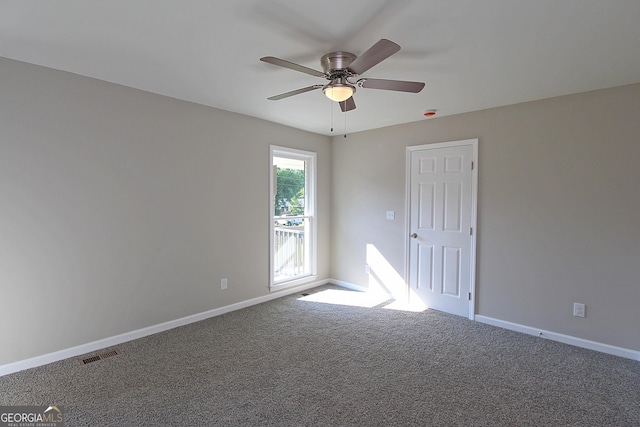 413 Spring Village Rd SE, Lindale, GA 30147 - spare room with a ceiling fan and carpet floors