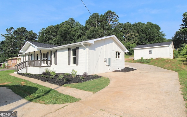 413 Spring Village Rd SE, Lindale, GA 30147 - view of front of home featuring covered porch, concrete driveway, and brick siding
