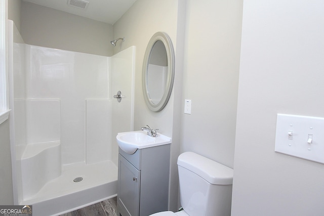 413 Spring Village Rd SE, Lindale, GA 30147 - bathroom featuring vanity, wood finished floors, and a shower