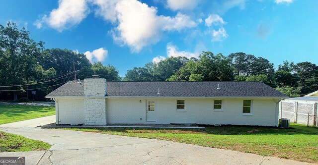 413 Spring Village Rd SE, Lindale, GA 30147 - view of property exterior with brick siding, a shingled roof, and a chimney