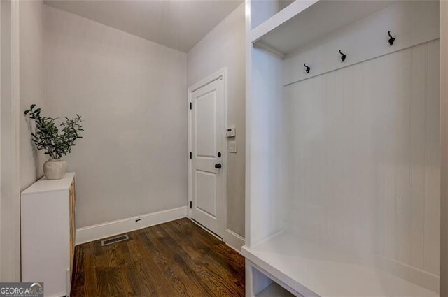 6863 Lake Sterling, Flowery Branch, GA 30542 - mudroom featuring dark wood-type flooring and baseboards