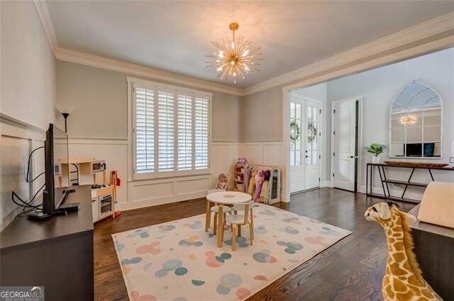 6863 Lake Sterling, Flowery Branch, GA 30542 - rec room with a chandelier, dark wood-type flooring, healthy amount of natural light, wainscoting, and crown molding