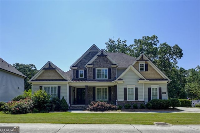 6863 Lake Sterling, Flowery Branch, GA 30542 - craftsman inspired home with a front lawn, a standing seam roof, a metal roof, and a porch