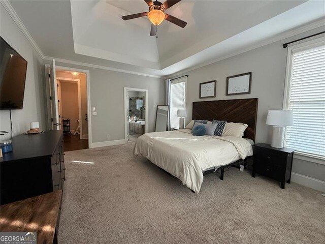 6863 Lake Sterling, Flowery Branch, GA 30542 - carpeted bedroom with a tray ceiling, connected bathroom, ceiling fan, and crown molding