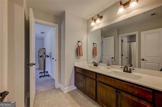 6863 Lake Sterling, Flowery Branch, GA 30542 - bathroom with double vanity and tile patterned floors