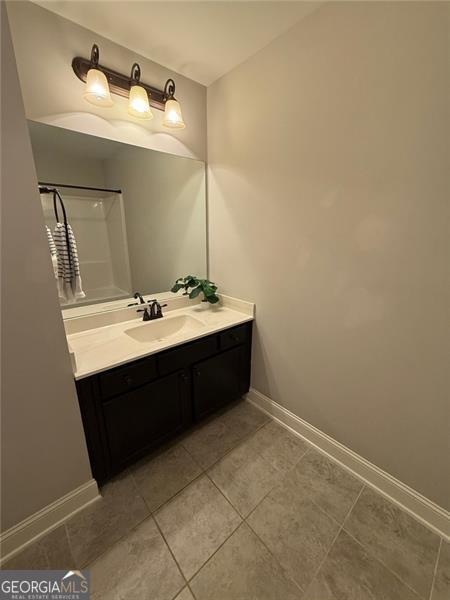 6863 Lake Sterling, Flowery Branch, GA 30542 - bathroom featuring vanity and tile patterned flooring
