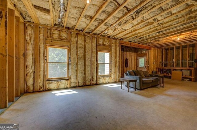 6863 Lake Sterling, Flowery Branch, GA 30542 - unfurnished living room featuring plenty of natural light