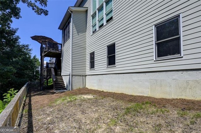 6863 Lake Sterling, Flowery Branch, GA 30542 - view of side of property featuring stairway