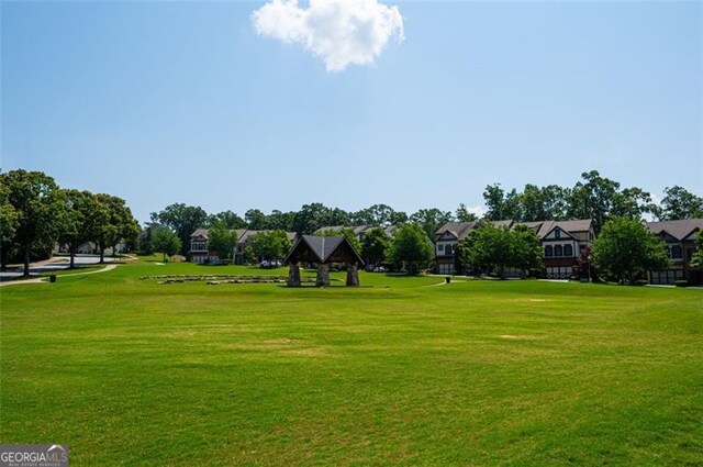 6863 Lake Sterling, Flowery Branch, GA 30542 - surrounding community with a yard
