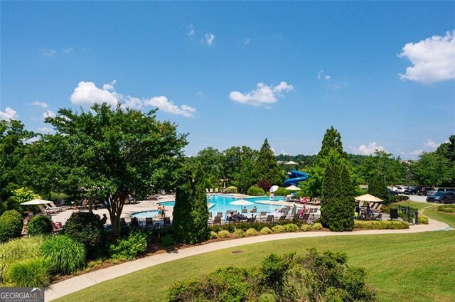 6863 Lake Sterling, Flowery Branch, GA 30542 - view of community featuring a yard and a pool