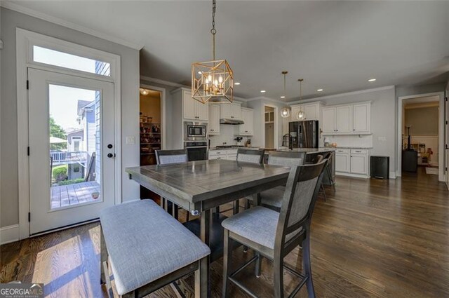 6863 Lake Sterling, Flowery Branch, GA 30542 - dining space with plenty of natural light, crown molding, a chandelier, recessed lighting, and dark wood-type flooring