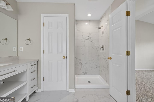 591 Wendlebury Ct, Alpharetta, GA 30004 - bathroom with marble look tile flooring, vanity, a marble finish shower, and recessed lighting