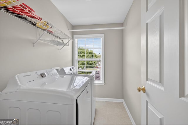 591 Wendlebury Ct, Alpharetta, GA 30004 - laundry room featuring washer and clothes dryer and light tile patterned flooring