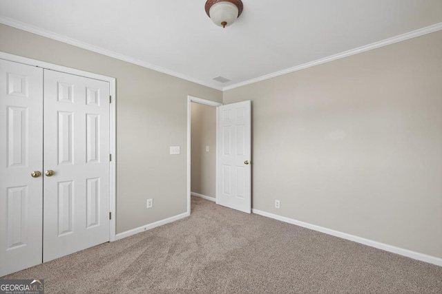 591 Wendlebury Ct, Alpharetta, GA 30004 - unfurnished bedroom with ornamental molding, carpet floors, and a closet