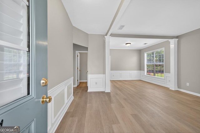 591 Wendlebury Ct, Alpharetta, GA 30004 - empty room featuring ornate columns, light wood finished floors, wainscoting, and a decorative wall