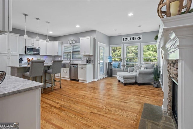 428 Gold Xing, Canton, GA 30114 - living area with light wood finished floors, a fireplace, and recessed lighting