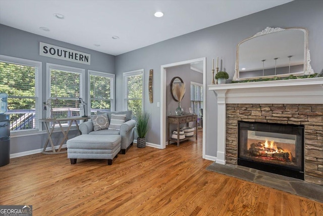 428 Gold Xing, Canton, GA 30114 - living area with wood finished floors, a stone fireplace, and recessed lighting