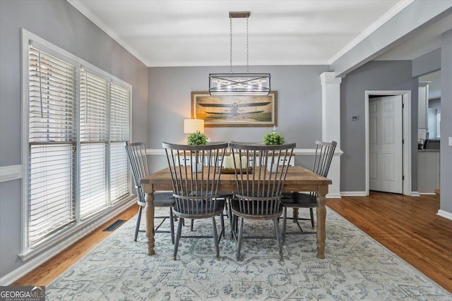 428 Gold Xing, Canton, GA 30114 - dining room featuring wood finished floors, ornamental molding, and decorative columns