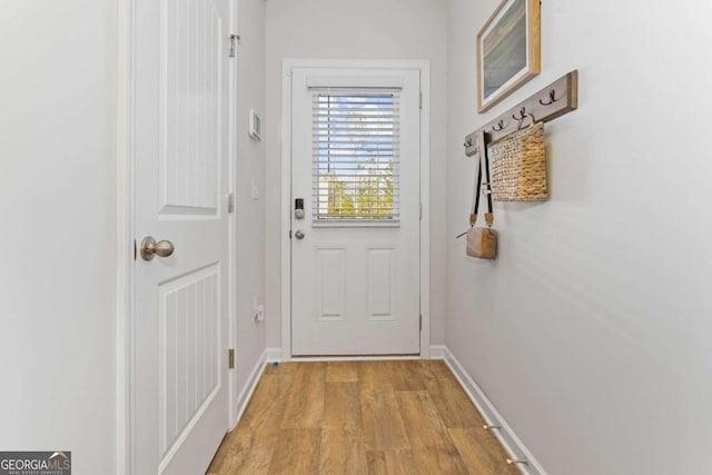 235 Ivey Ter, Temple, GA 30179 - doorway featuring light wood-style floors and baseboards
