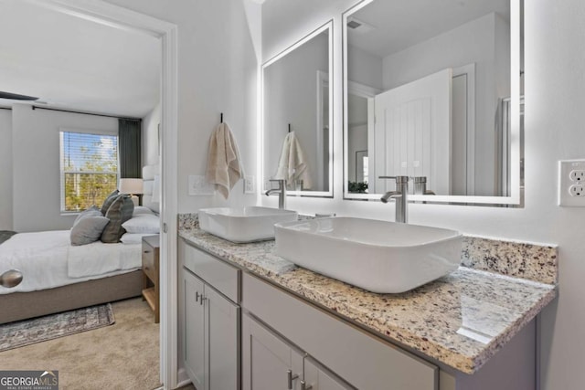235 Ivey Ter, Temple, GA 30179 - full bathroom with double vanity and connected bathroom