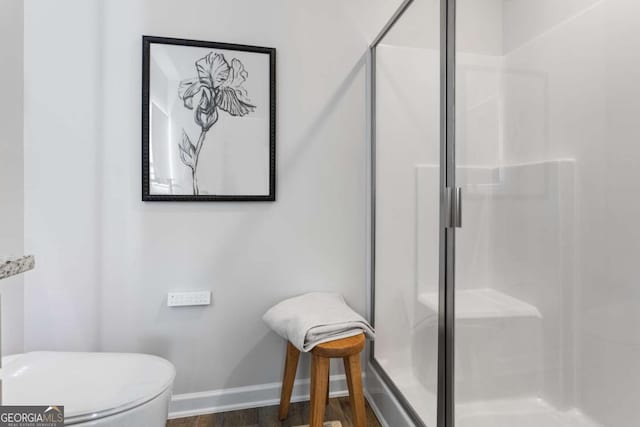 235 Ivey Ter, Temple, GA 30179 - full bath featuring a stall shower and wood finished floors