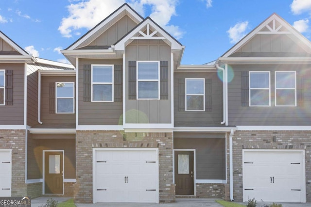 235 Ivey Ter, Temple, GA 30179 - townhome / multi-family property featuring board and batten siding, an attached garage, and brick siding