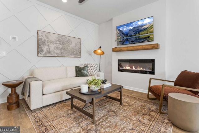 235 Ivey Ter, Temple, GA 30179 - living room with wood finished floors and a glass covered fireplace