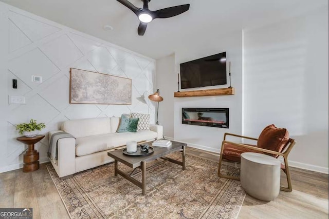 235 Ivey Ter, Temple, GA 30179 - living room with a ceiling fan, wood finished floors, and a glass covered fireplace