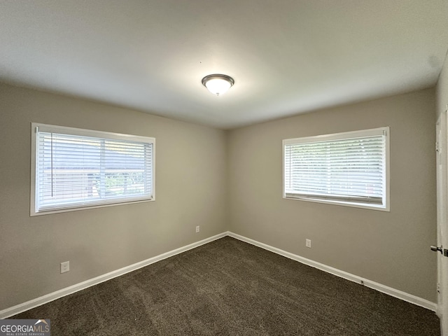 2644 Connally Dr, East Point, GA 30344 - unfurnished room with plenty of natural light and dark colored carpet